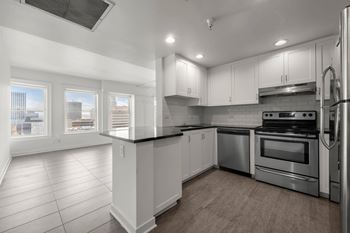 Kitchen with living room view at Grand Central Market Apartments, Los Angeles, CA, 90013